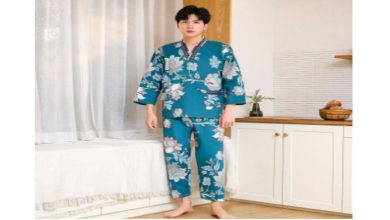 a man wearing blue Chinese sleepwear with floral patterns
